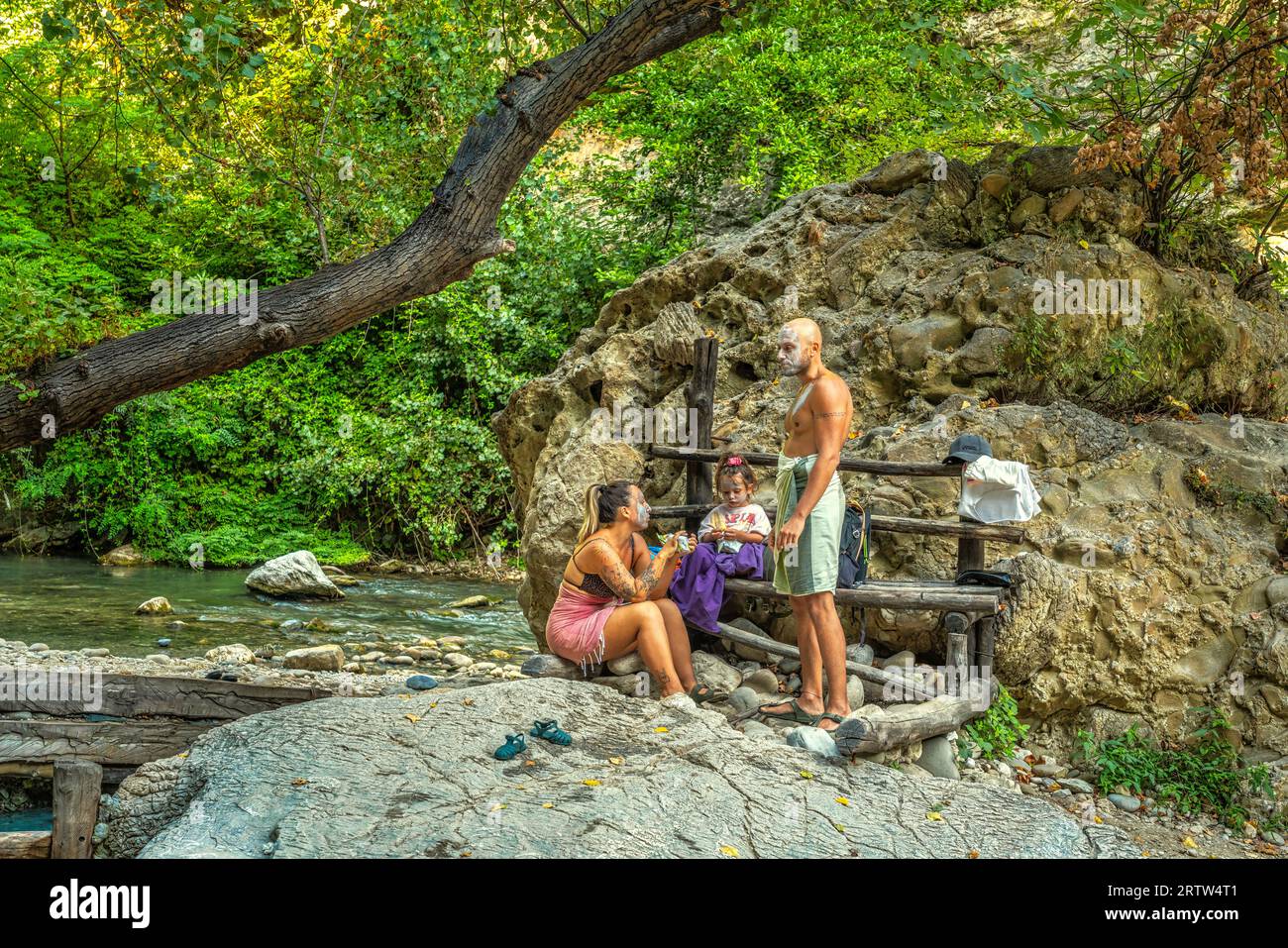 Elderly people and families bathe in the thermal and sulfur springs of Lu Vurghe near Acquasanta Terme. Province of Ascoli Piceno, Marche region Stock Photo