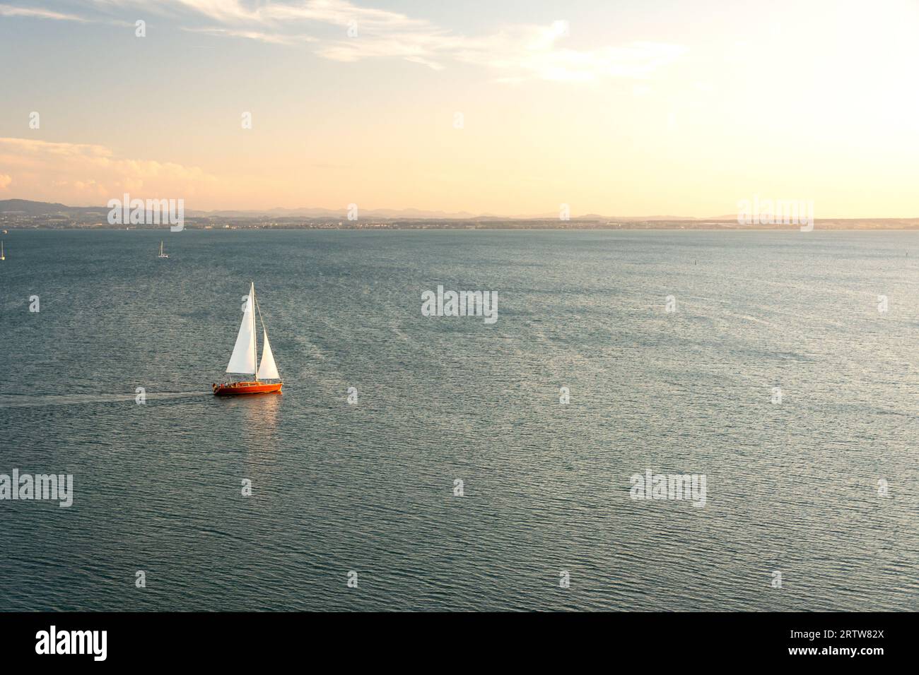 Sailing boat at sunset hi-res stock photography and images - Alamy