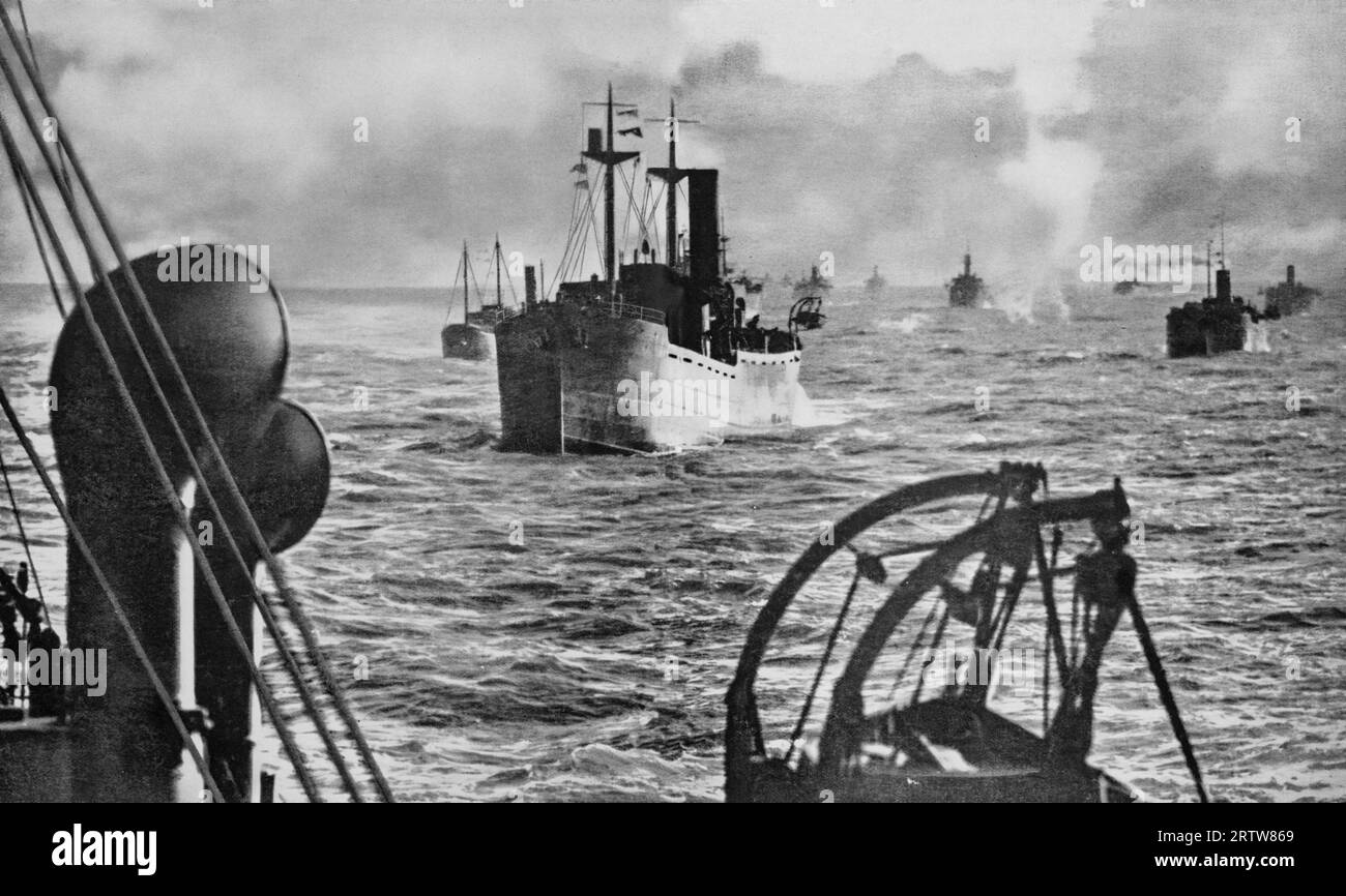 A fleet of merchant ships travelling in convoy in January 1940. Experience gained in World War One, proved that freighters travelling together in large groups with an escort of warships had less risk of attack from enemy U-boats Stock Photo