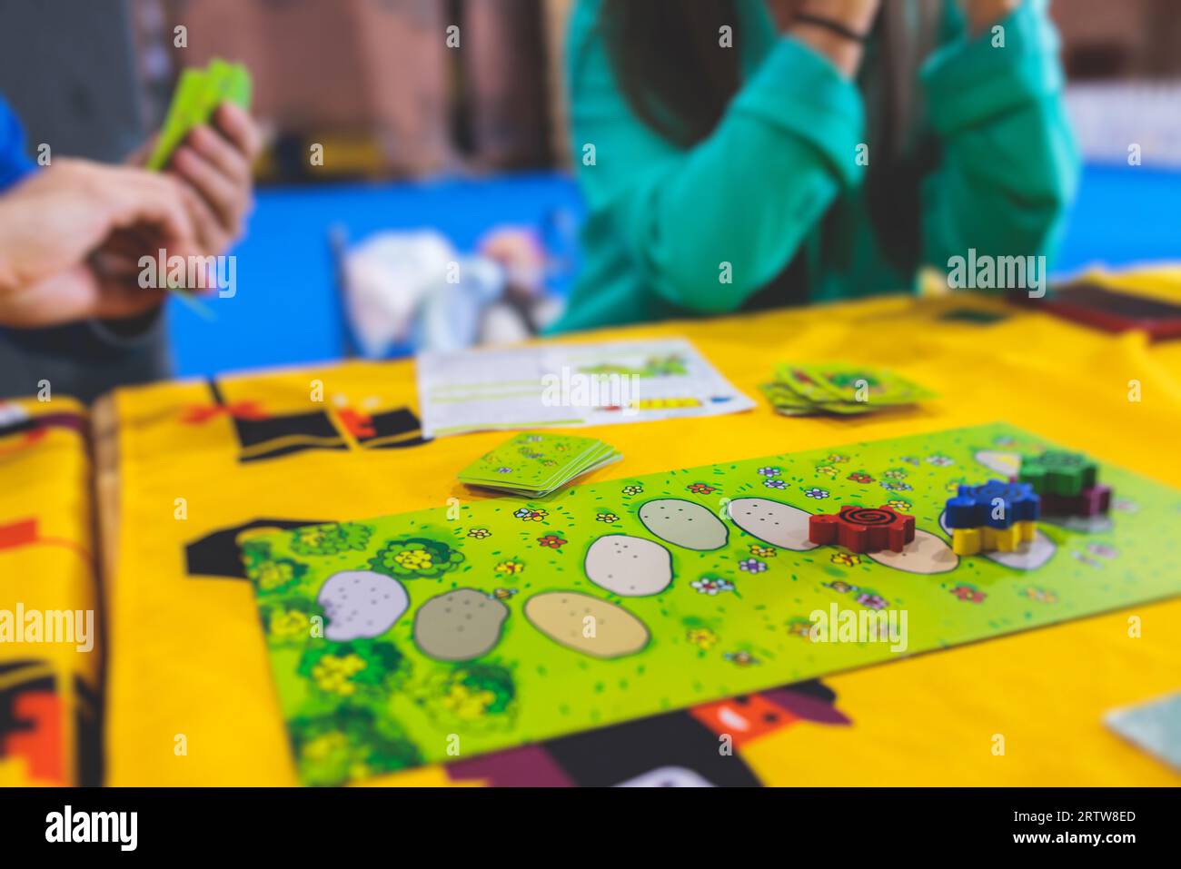 Process of playing board game and having fun with friends and family in