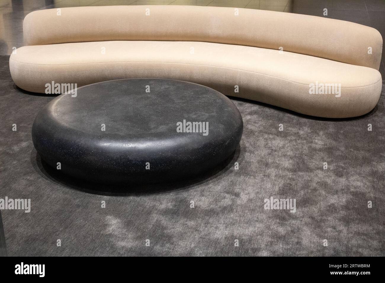abstract couch design with a circle table to sit on Stock Photo Alamy