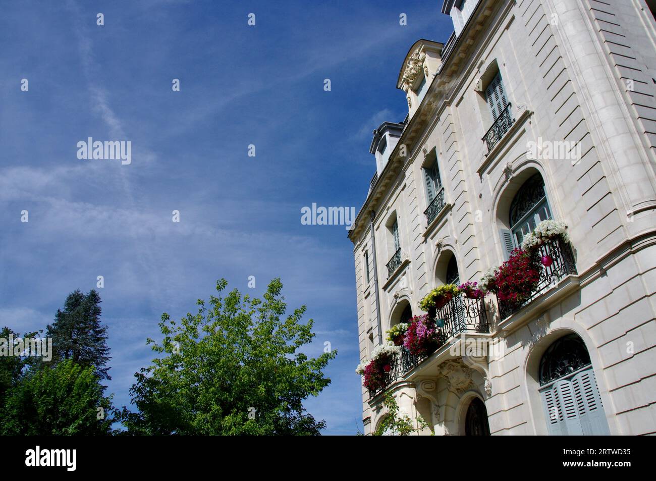 Vichy, France, August 16, 2012. Historic Building with flowers under a blue sky. Stock Photo