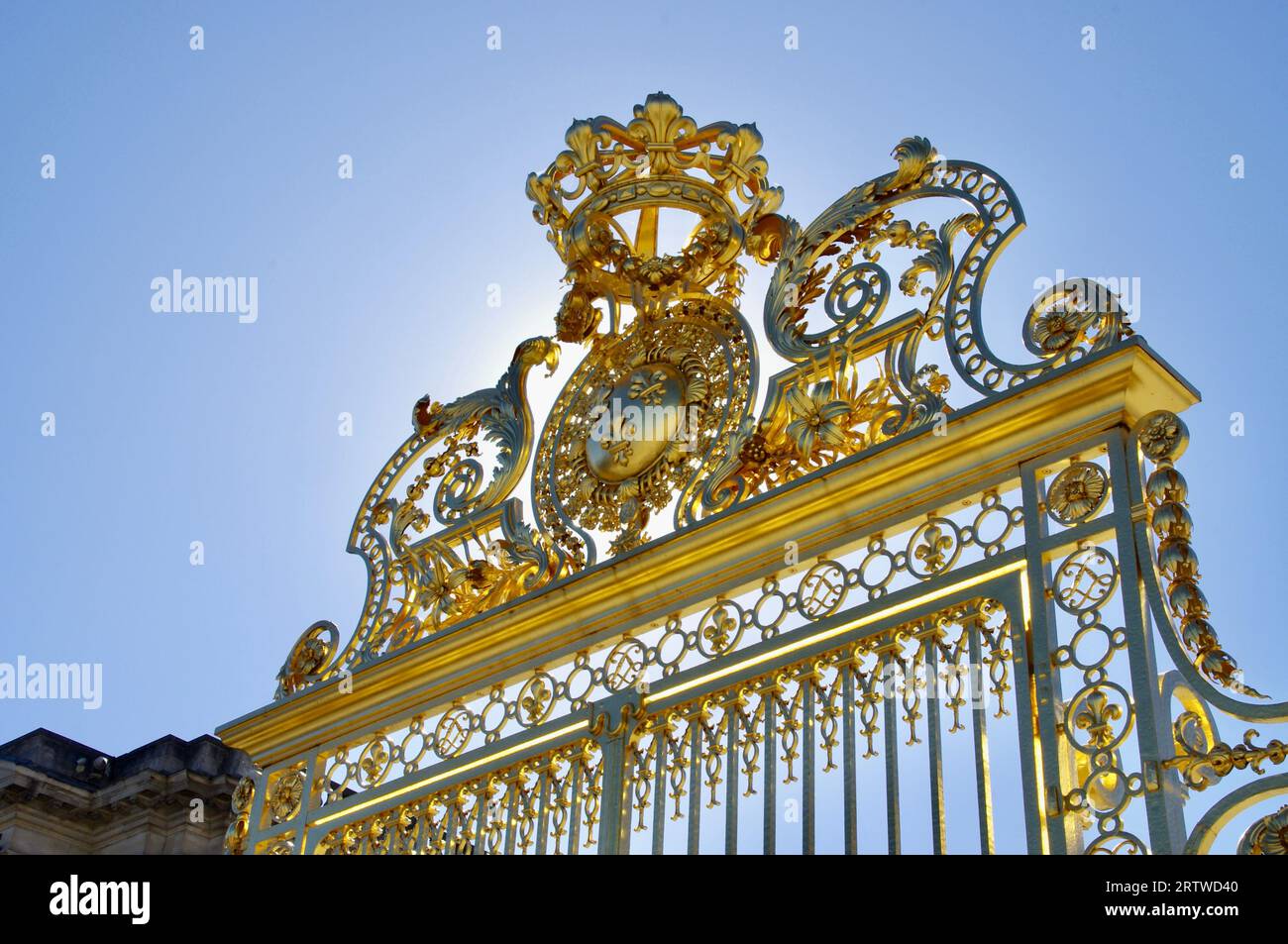 The beautiful Golden Gates outside The Palace of Versailles, under a