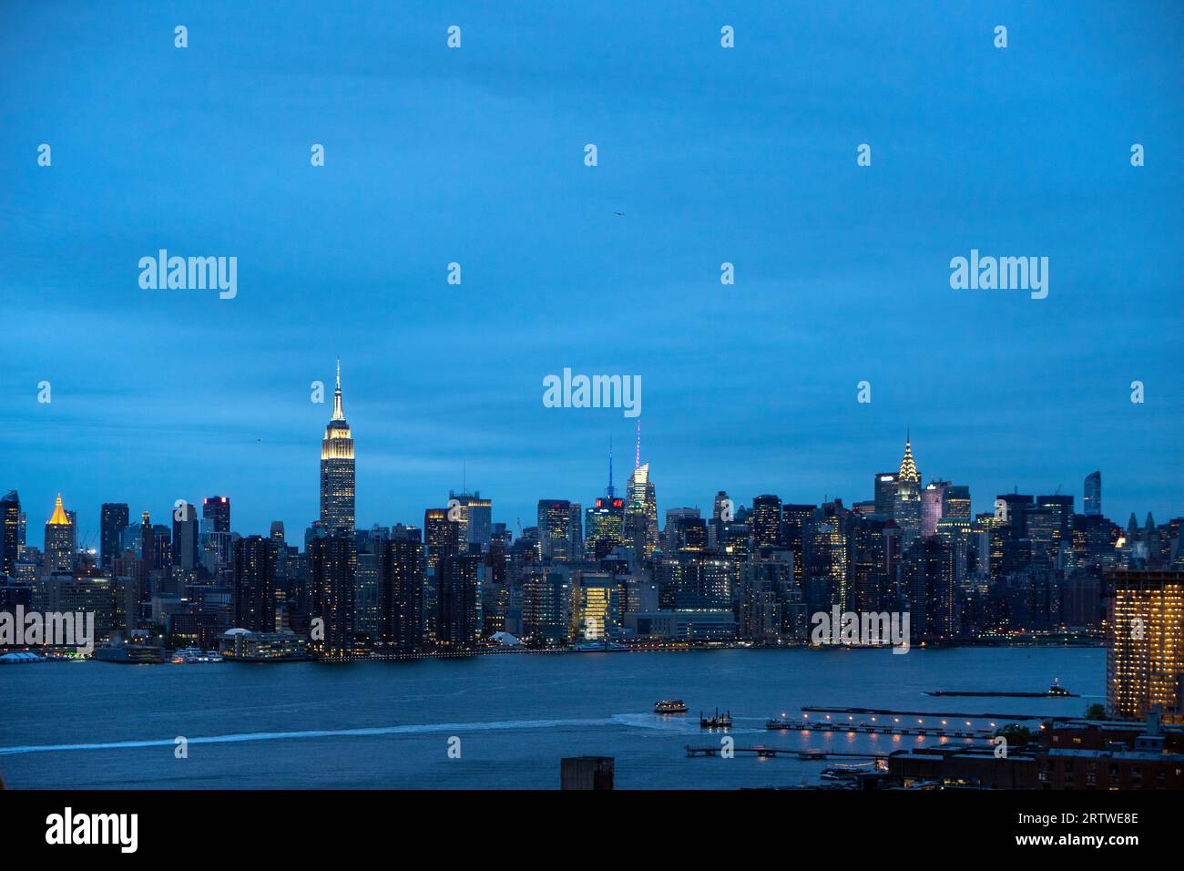 New York City skyline at night from the East River in Brooklyn Stock ...