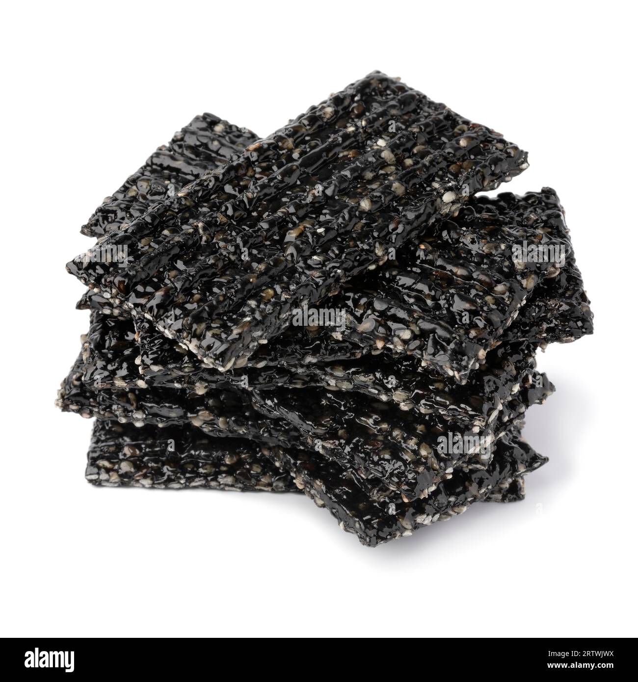 Pile of black sesame snaps isolated on white background close up Stock Photo