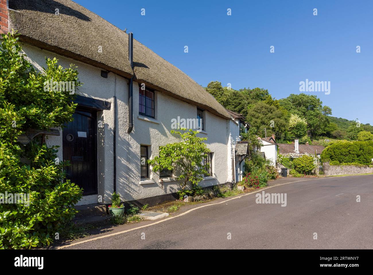 A thatched cottage in Porlock Weir on the Exmoor National Park coast, Somerset, England. Stock Photo