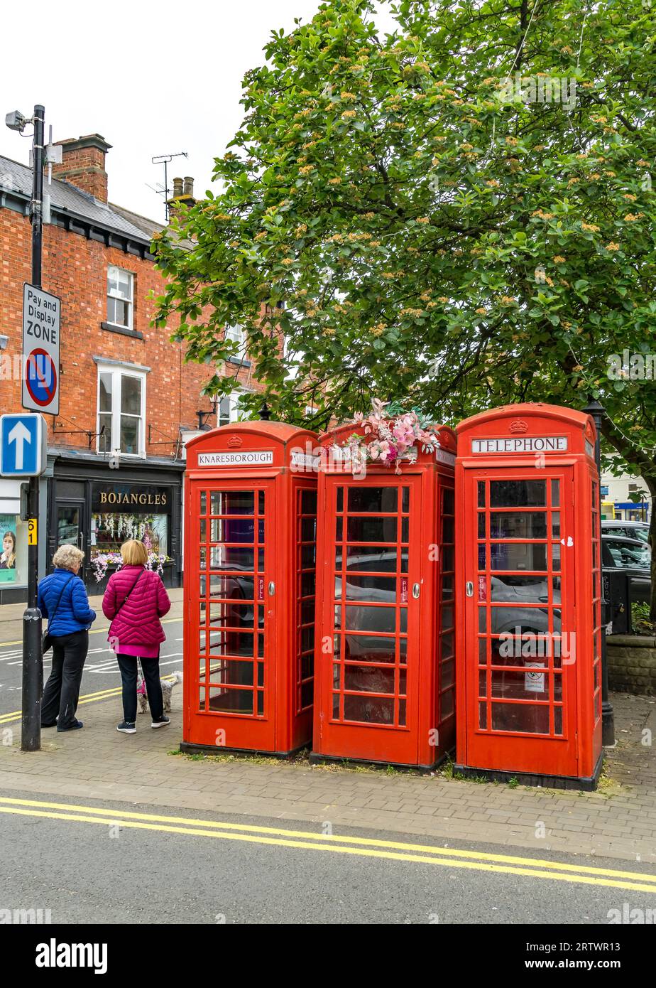 Three telephone kiosks in a row, Knaresborough market place, Knaresborough, North Yorkshire, England, UK Stock Photo