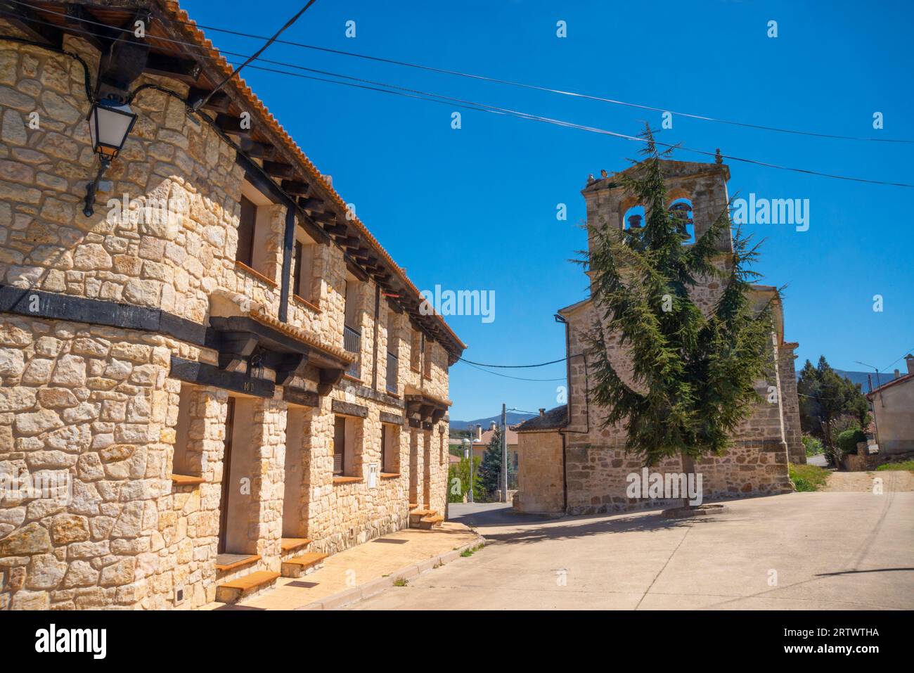 Street and church. Cerezo de Abajo, Segovia province, Castilla Leon, Spain. Stock Photo