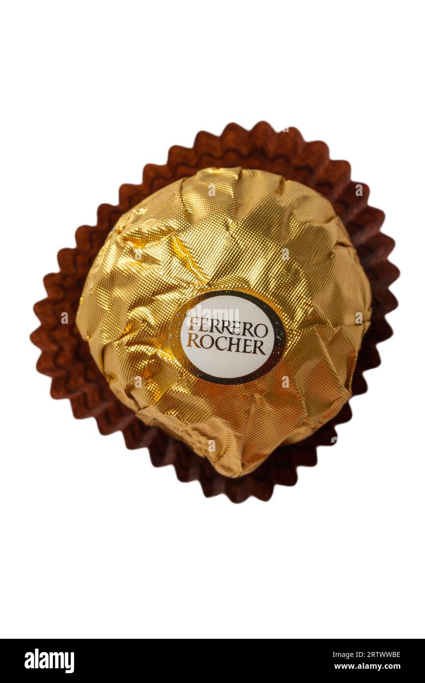 Ferrero Rocher chocolate isolated on white background - whole hazelnut in milk chocolate and nut croquante Stock Photo