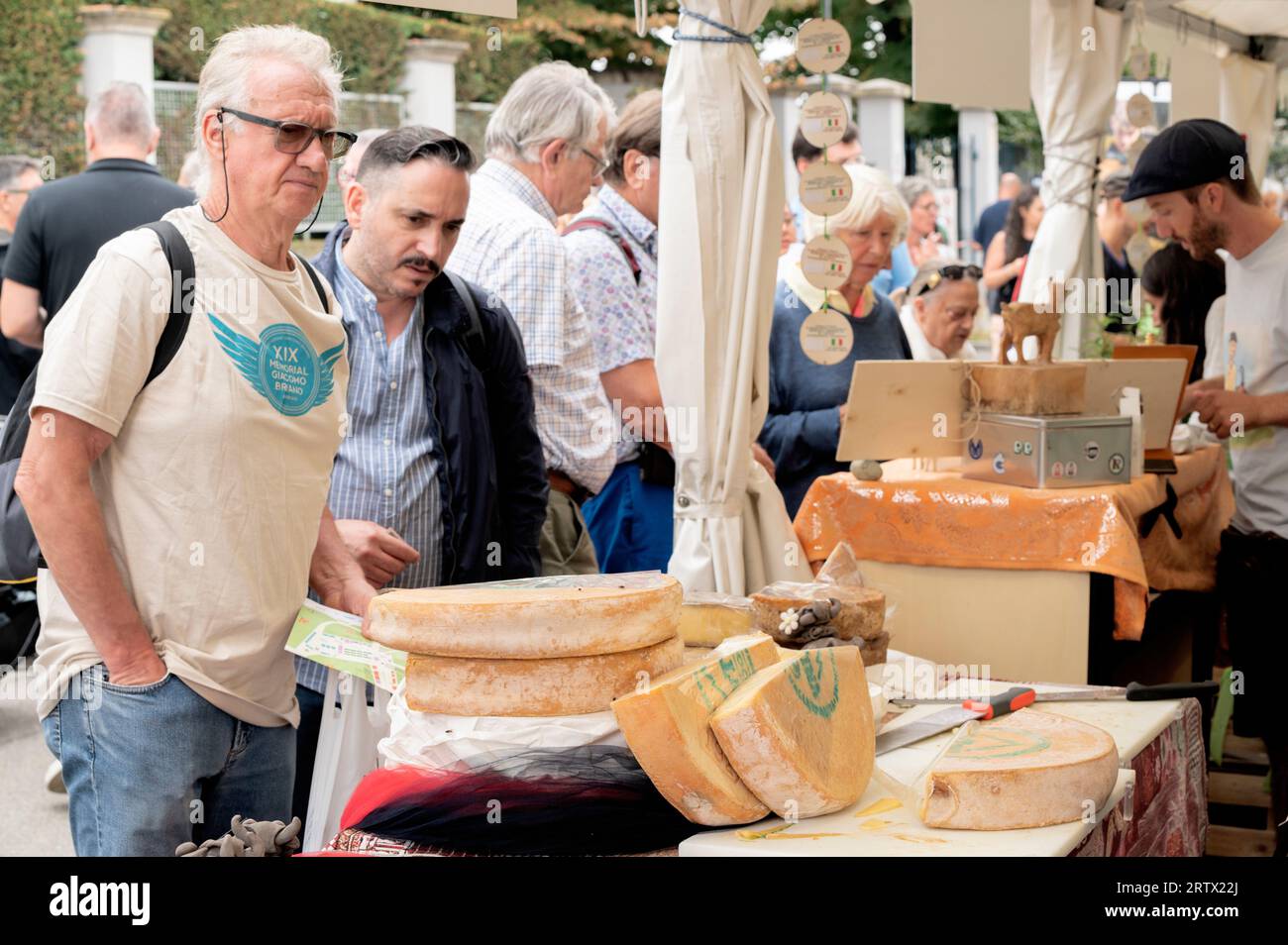 Bra (Cuneo), Italy. 15th September 2023. Inauguration of the XIV edition of the international Cheese fair, organized by the Slow Food movement and the municipal administration of Bra. In this image you can see some visitors to the fair intent on tasting the cheeses on display. Credit: Luca Prestia / Alamy Live News Stock Photo