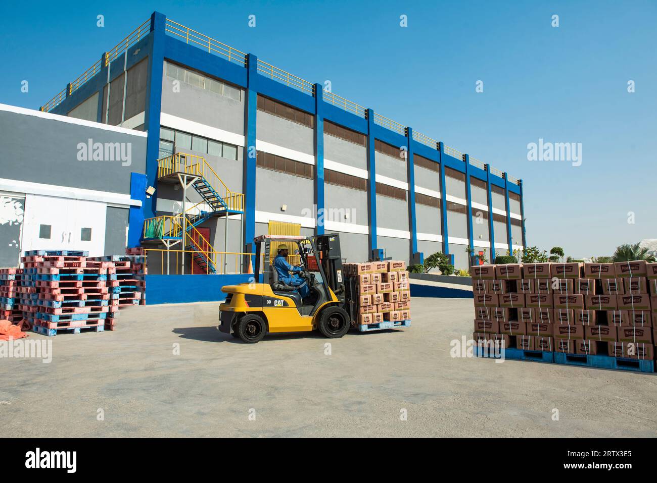 Forklift Truck working at Warehouse Stock Photo