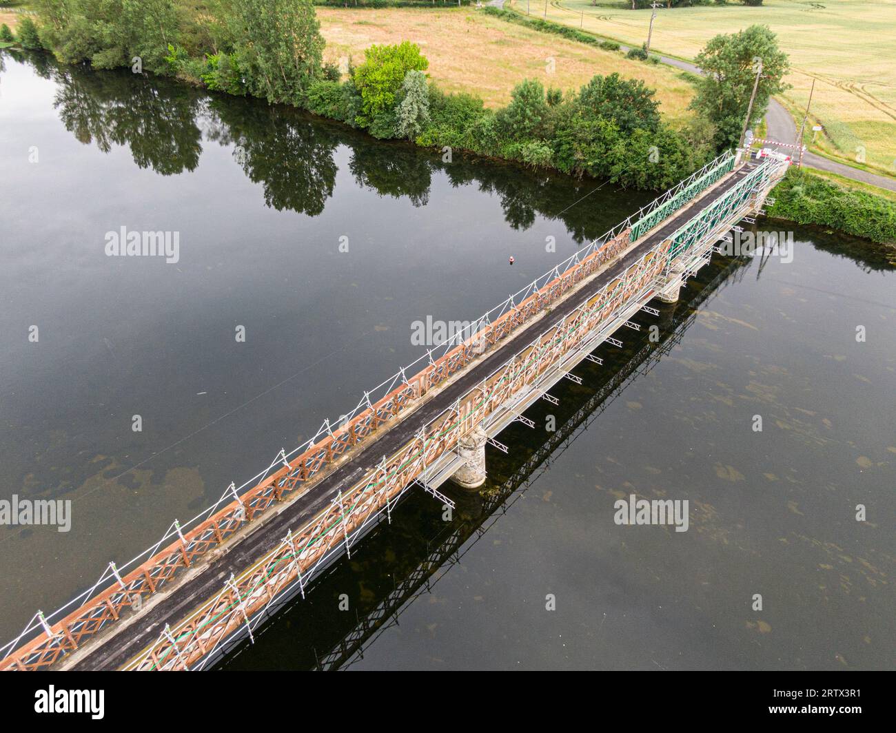 Scaffolding used for maintenance or restoration work on a small bridge over a large river the Cher Stock Photo
