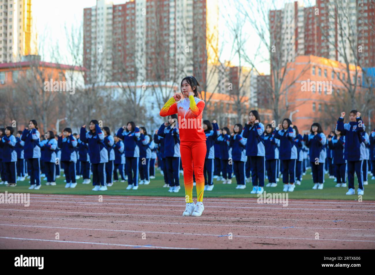 LUANNAN COUNTY, China - December 6, 2021: Middle school students' ice and snow aerobics performance is on the playground, North China Stock Photo