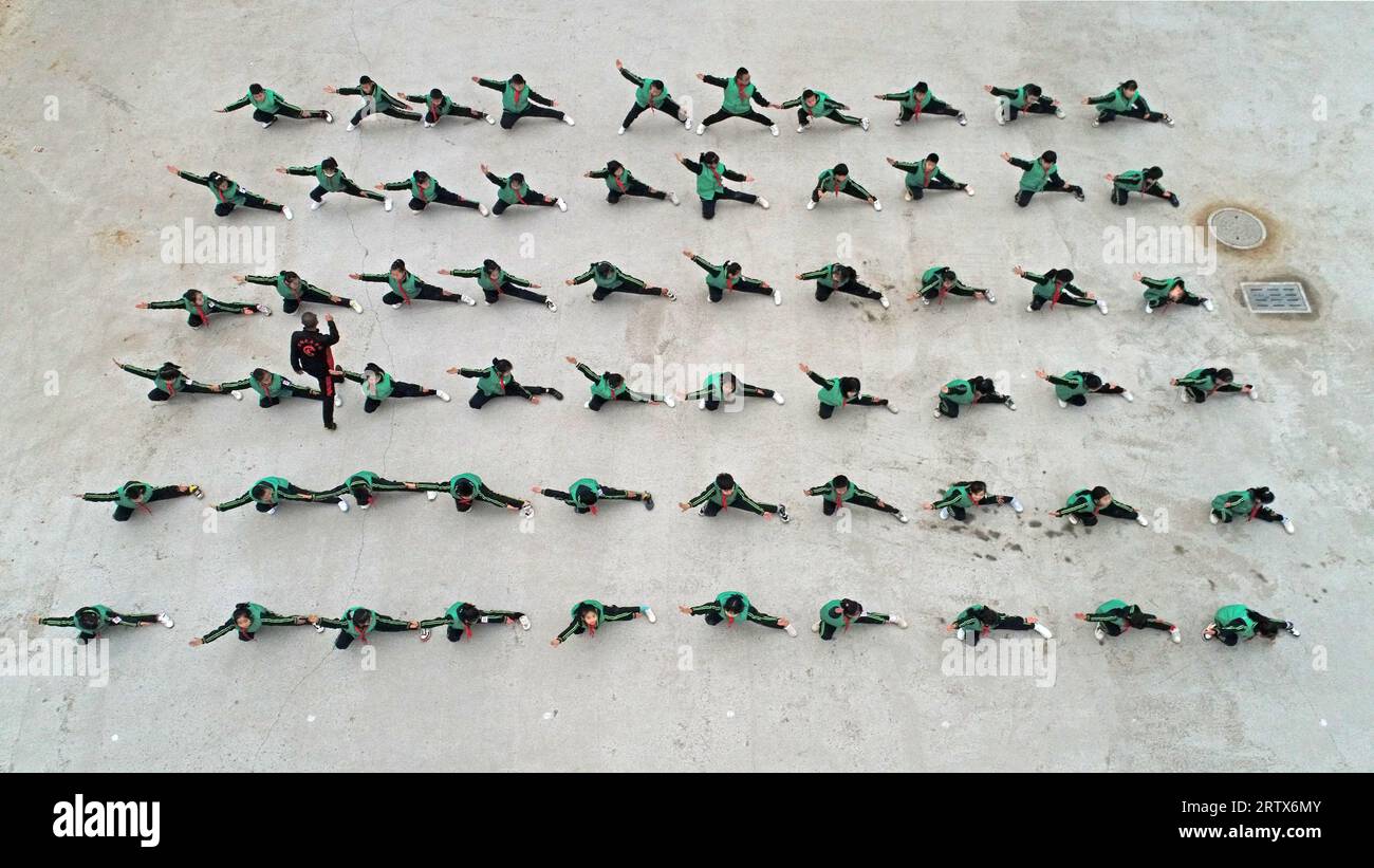 Primary school students are practicing the basic skills of Chinese Traditional martial arts