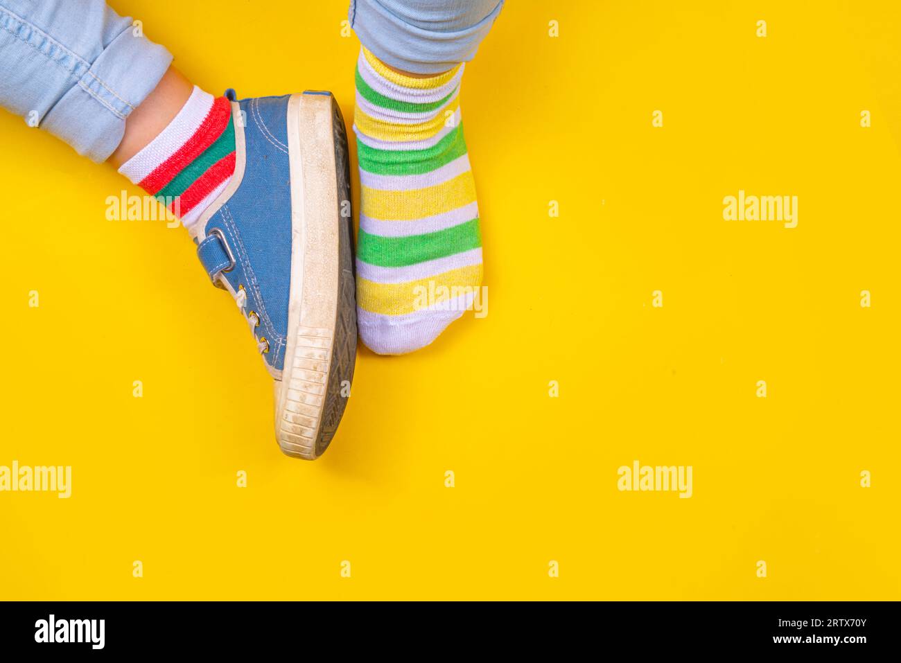 Odd Socks Day, Lonely Sock Day. AntiBullying Week, Down syndrome awareness. Child legs wearing