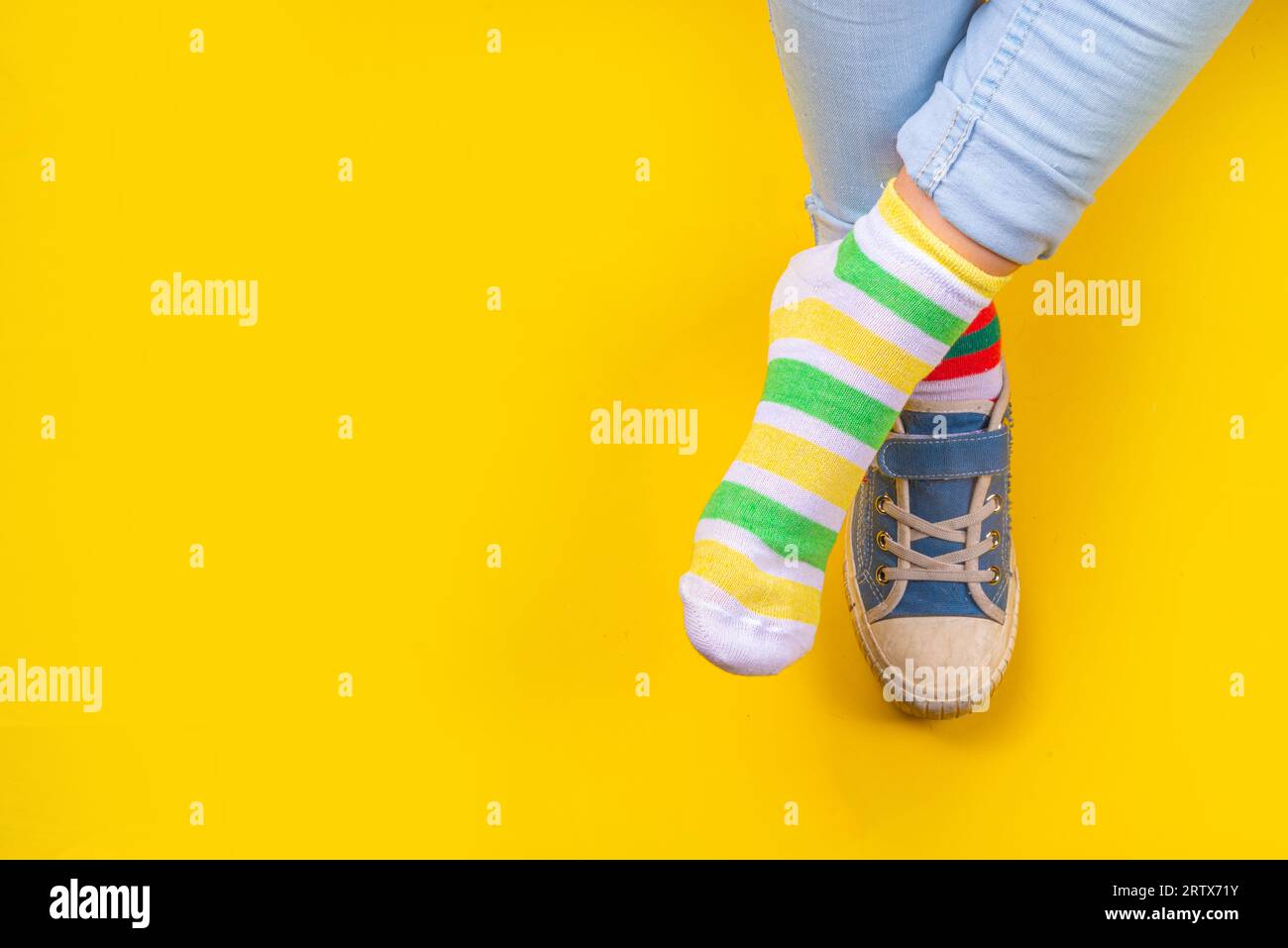Odd Socks Day, Lonely Sock Day. AntiBullying Week, Down syndrome awareness. Child legs wearing