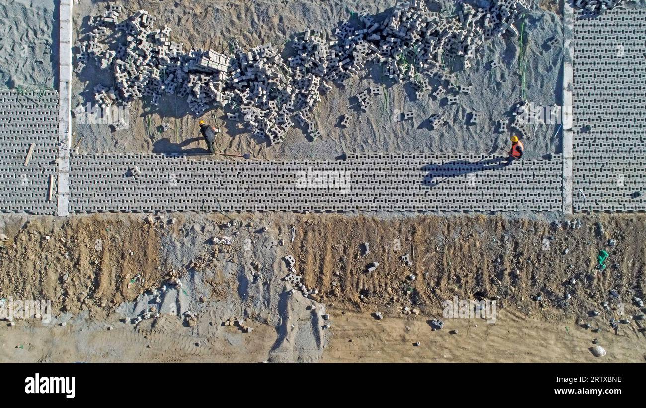 Slope Protection For Rivers Workers are building river slope protection at a water conservancy ...