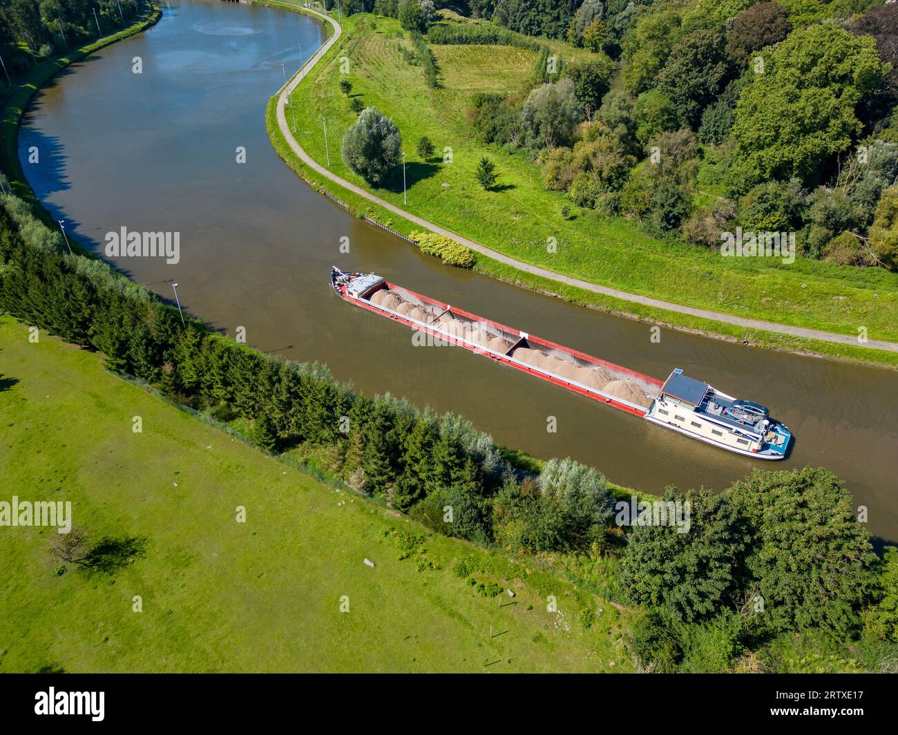 Lembeek, Halle, Vlaams Brabant, Belgium,Sep 5th 2023, cargo ship or barge passing on the Canal Brussels Charleroi, which is a man made waterway in Belgium. It's still in active use in transporting goods and raw material. High quality photo Stock Photo