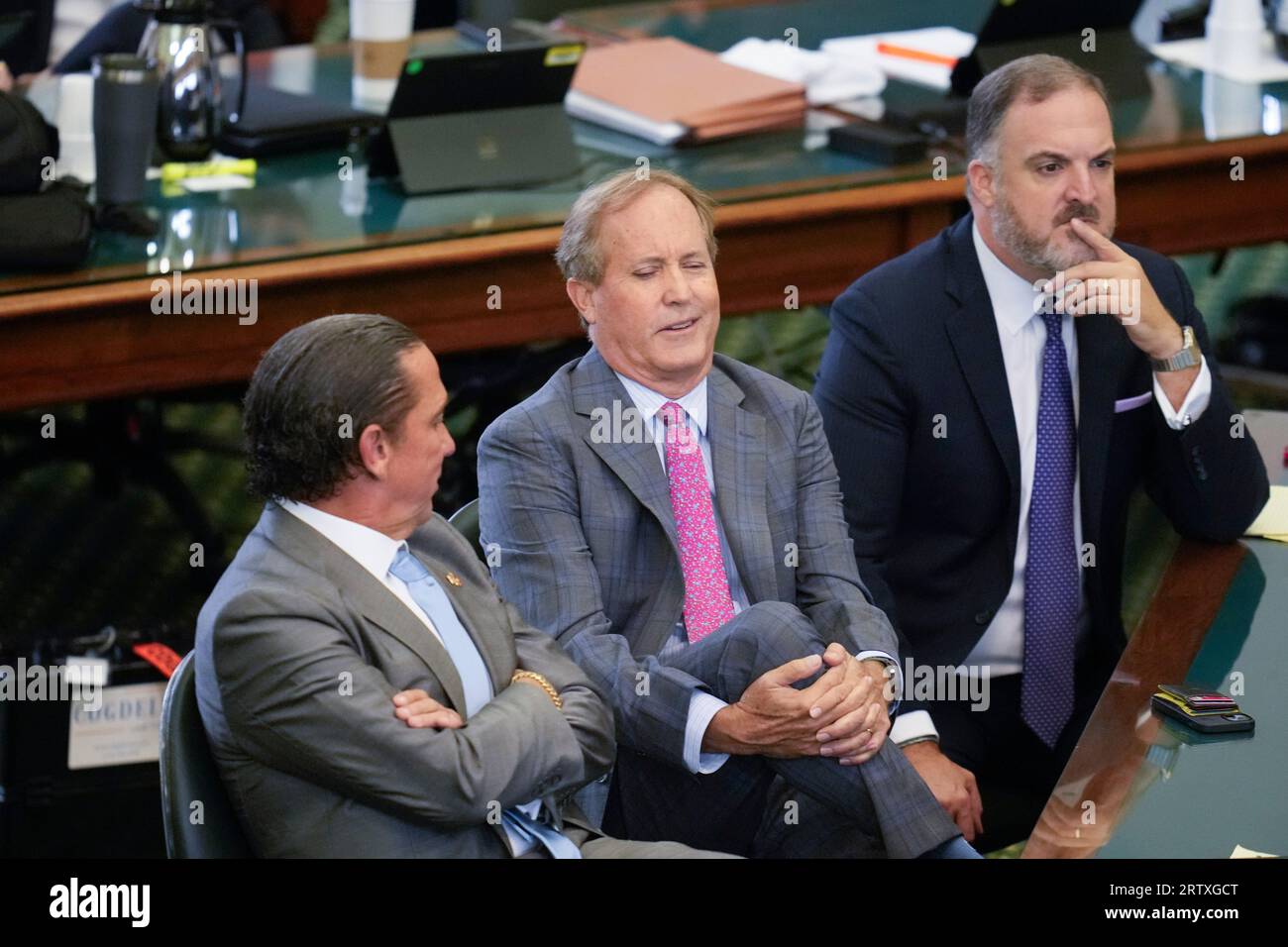 Suspended Texas attorney general KEN PAXTON sits between attorneys TONY BUZBEE, l, and MITCH LITTLE, r, during the morning on day nine as both sides have rested in Texas Attorney General Ken Paxton's impeachment trial in the Texas Senate on September 15, 2023. THe charges will go to the jury today. Credit: Bob Daemmrich/Alamy Live News Stock Photo