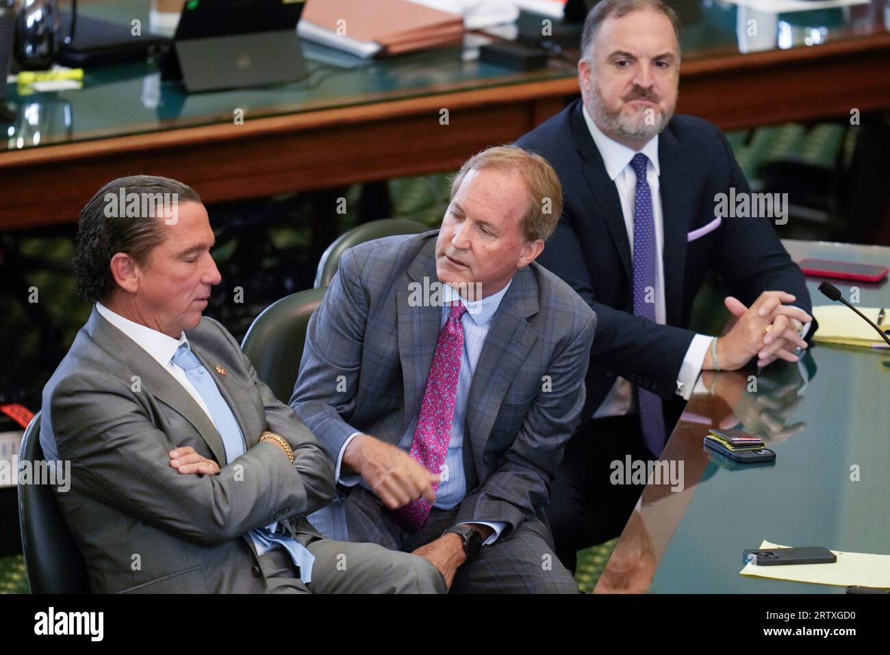Suspended Texas attorney general KEN PAXTON sits between attorneys TONY BUZBEE, l, and MITCH LITTLE, r, during the morning on day nine as both sides have rested in Texas Attorney General Ken Paxton's impeachment trial in the Texas Senate on September 15, 2023. THe charges will go to the jury today. Credit: Bob Daemmrich/Alamy Live News Stock Photo