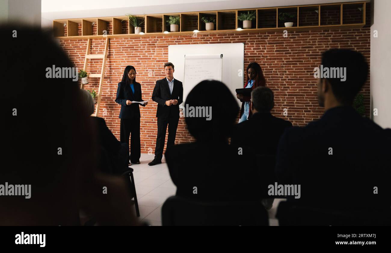 Multiracial business people working inside conference room - Team of diverse creative entrepreneurs doing meeting work Stock Photo