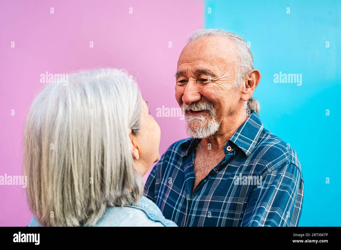 Happy senior couple having tender moments outdoor - Elderly people and love relationship concept Stock Photo