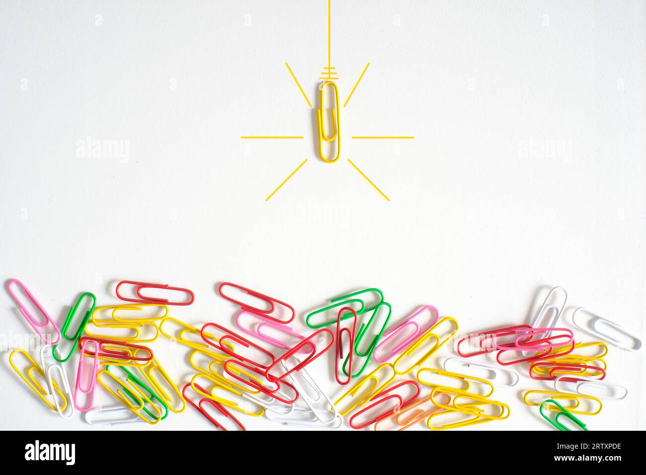 concept,metaphor,idea,solution,innovation,idea,unique selling point,start up and human resources concept with paper clip as lightbulbs, flat lay, copy Stock Photo