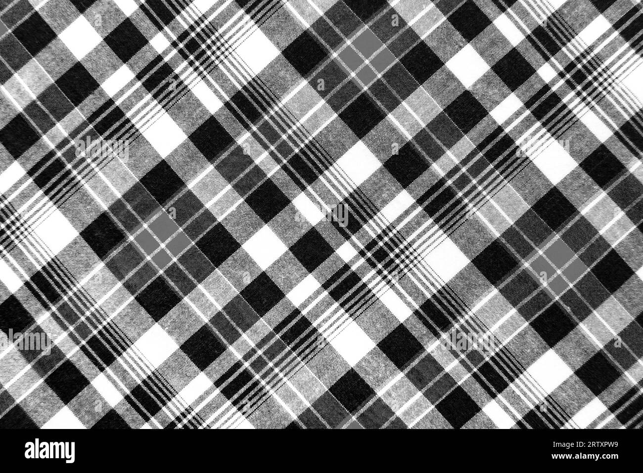 Black and white checkered fabric. Checkered material. Textile Stock