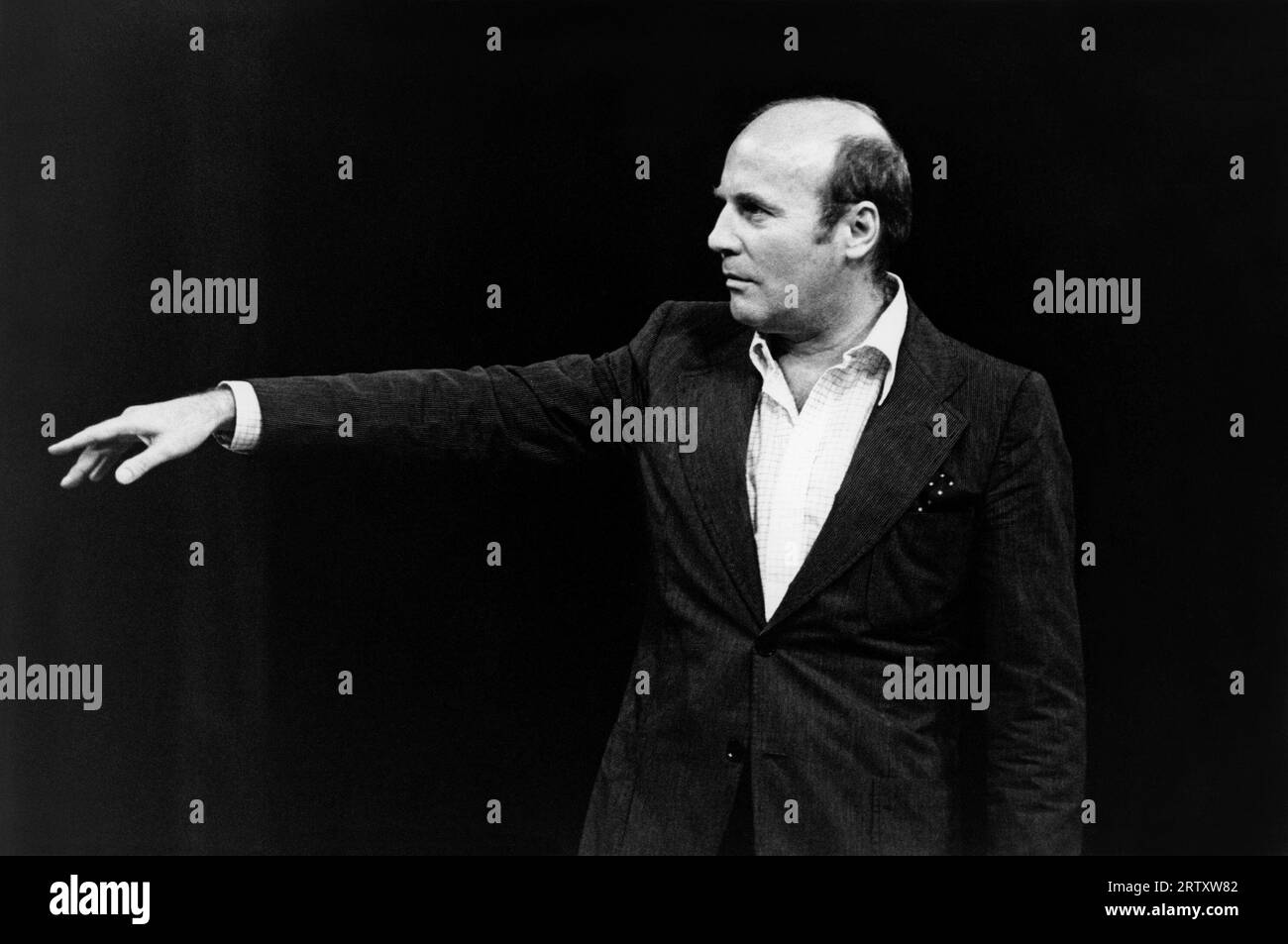 Hans Werner Henze directing at a rehearsal of his opera WE COME TO THE RIVER at the Royal Opera, London WC2 in 1976  text: Edward Bond  assistant director: David Pountney Stock Photo