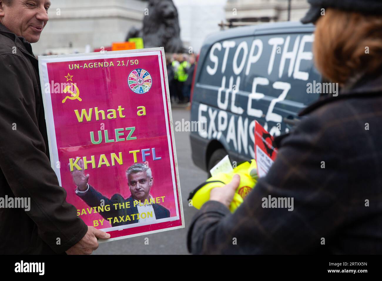 Participants gather with placards during a protest against the expansion of London's ultra-low emission zone (ULEZ) around Trafalgar Square in London. Stock Photo