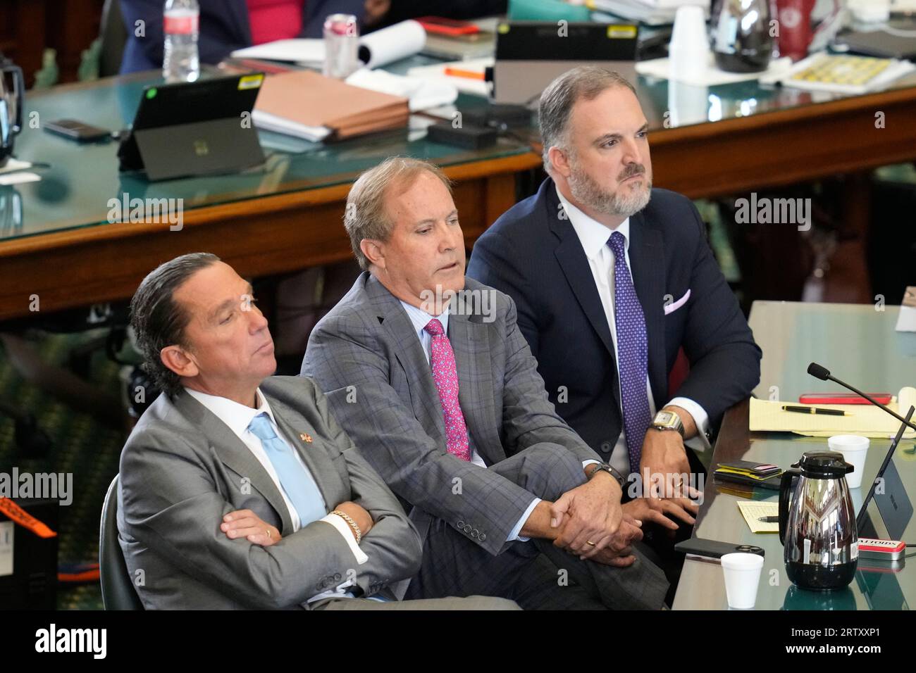 Suspended attorney general KEN PAXTON sits between his attorneys TONY BUZBEE, l, and MITCH LITTLE, r, during final prosecutor arguments as both sides have rested in Texas Attorney General Ken Paxton's impeachment trial in the Texas Senate on September 15, 2023. THe charges will go to the jury today. Credit: Bob Daemmrich/Alamy Live News Stock Photo