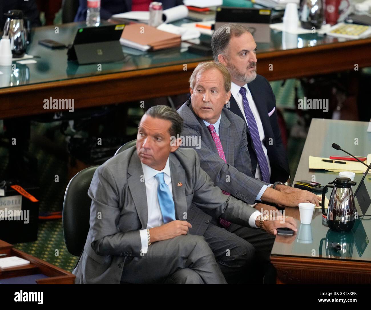 Suspended attorney general KEN PAXTON sits between his attorneys TONY BUZBEE, l, and MITCH LITTLE, r, during final prosecutor arguments as both sides have rested in Texas Attorney General Ken Paxton's impeachment trial in the Texas Senate on September 15, 2023. THe charges will go to the jury today. Credit: Bob Daemmrich/Alamy Live News Stock Photo