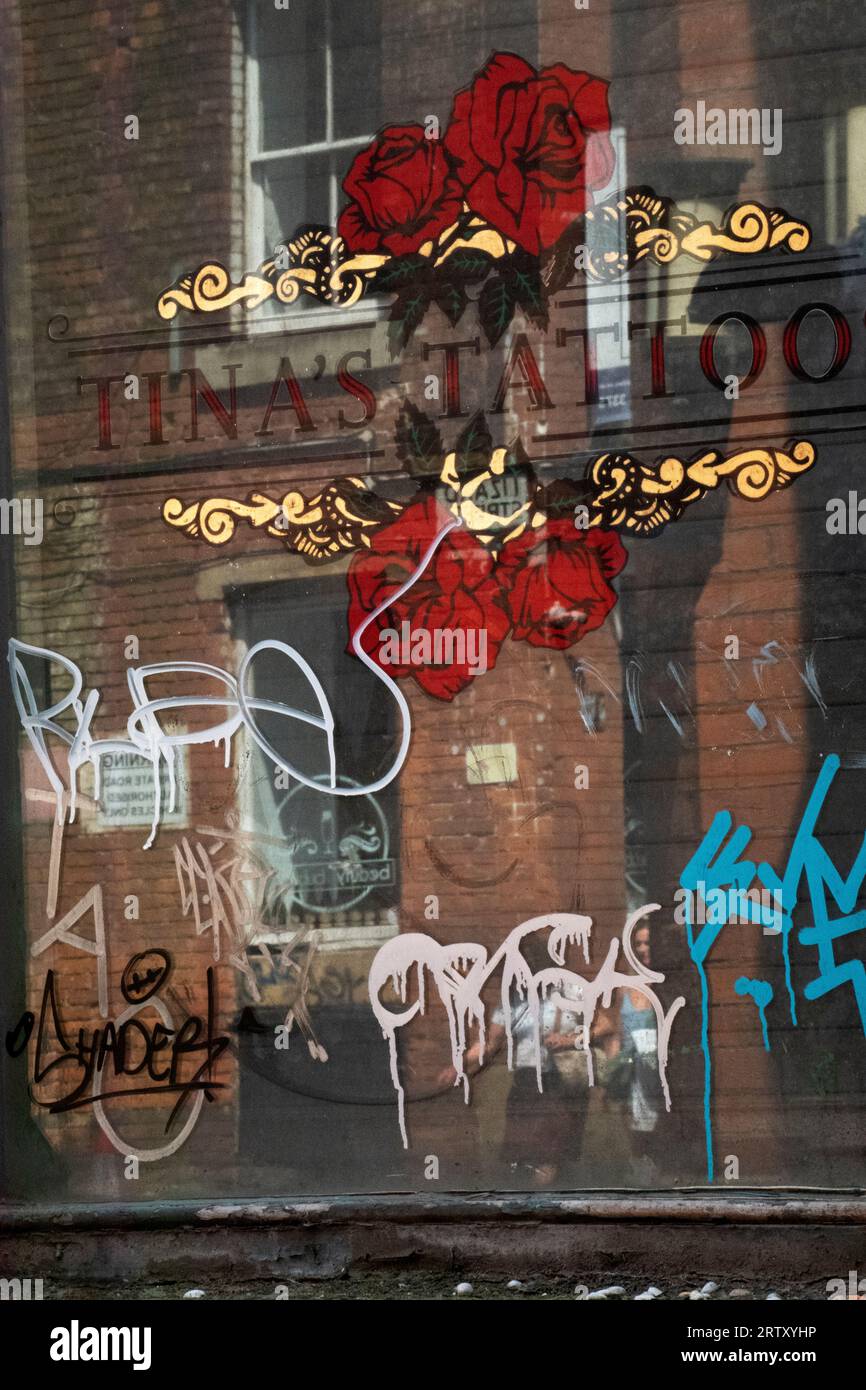 Tina's Tattoo Studio Window and Reflections Manchester, England, Britain Stock Photo