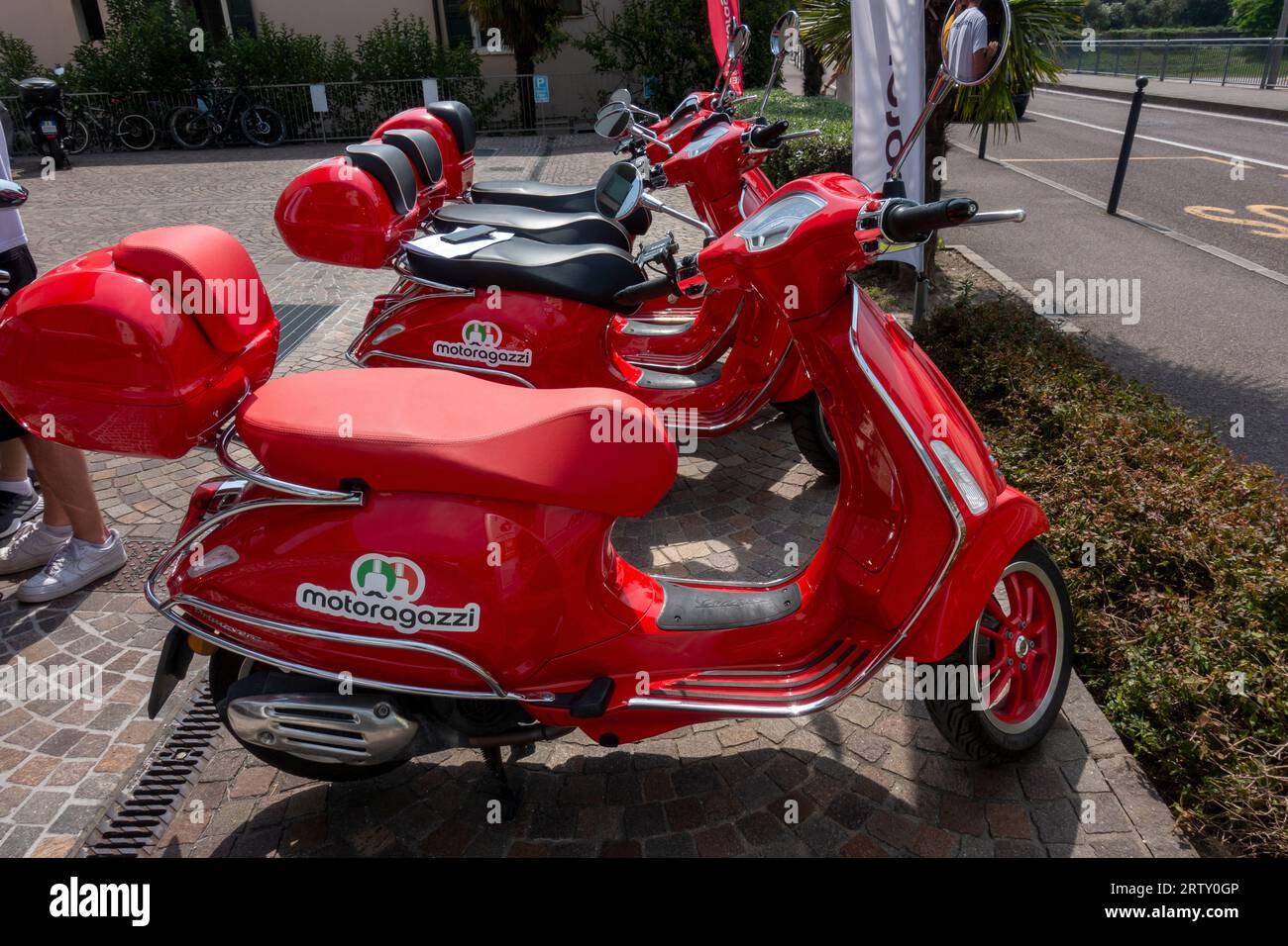 Red Vespa rental scooters, Riva, Rival del Garda, province of Trento of the Trentino Alto Adige region, Italy Stock Photo