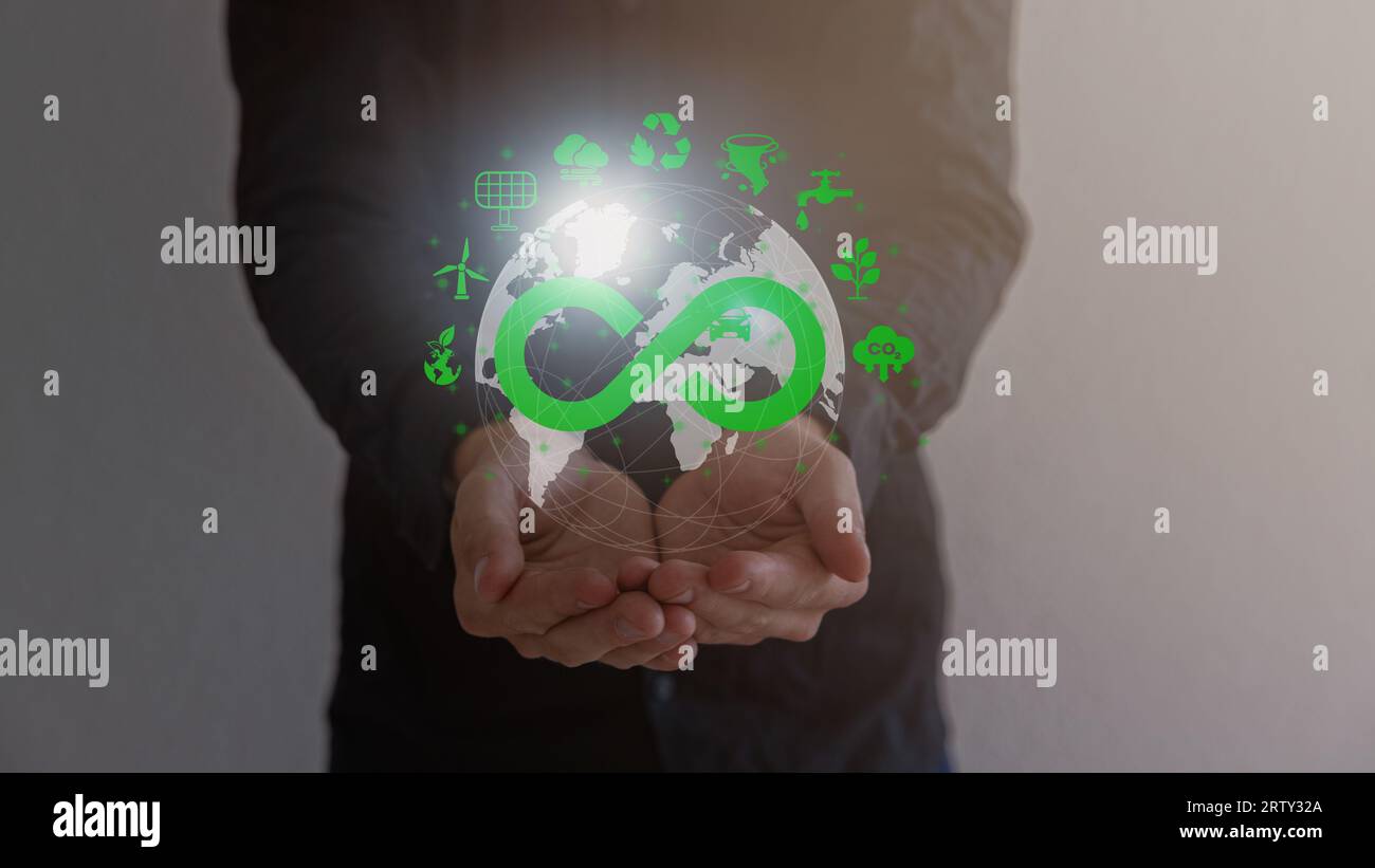 Businessman holding circular economy icon Circular economy concept for future business growth and environmental sustainability and reduce pollution. Stock Photo