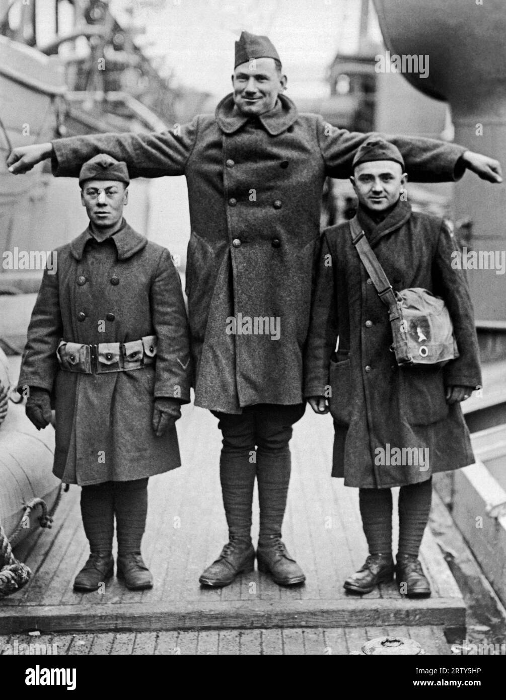 New York, New York,   March 19, 1919 The first large detachment of Ohio troops return to the United States. The whole and two halves here are 58 inches, 75 inches and 59 inches  tall. Stock Photo