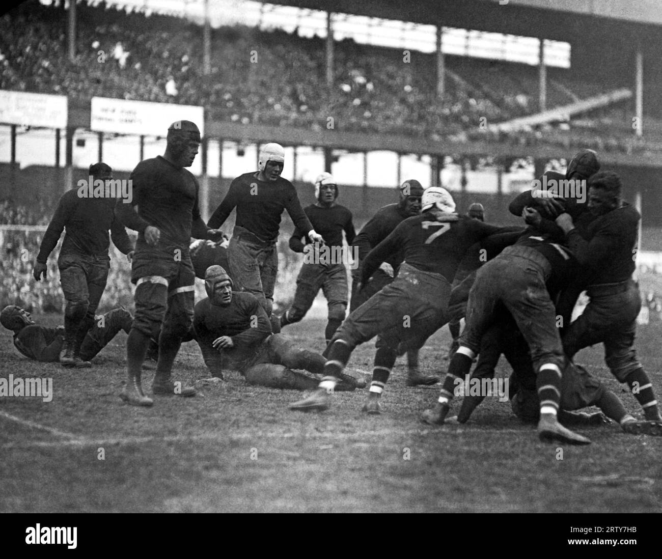 New York, New York  November 11, 1925  The Giants, New York's professional  football team, beat the  Kansas City Cowboys by a score of  9-3 this afternoon at the Polo Grounds.  Cowboys fullback C. Hill, formerly of Baylor University, shown being tackled. Stock Photo