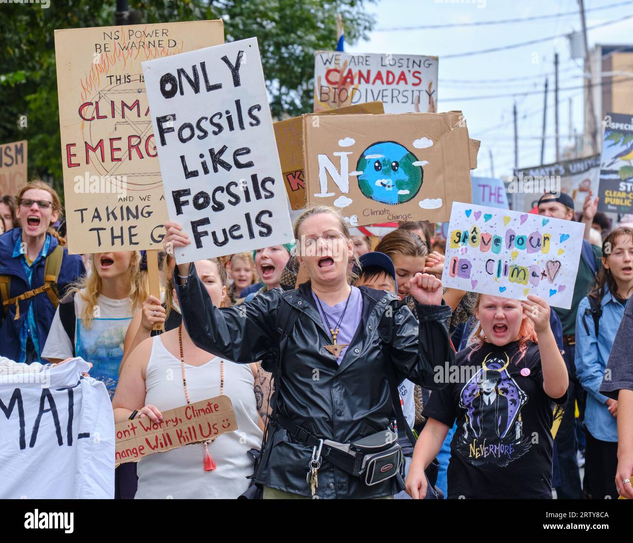 Halifax, Nova Scotia, Canada. September 15, 2023. Hundreds walk through the streets of Halifax in the Global Climate School Strike rally.. The march led by local youths, with support from many from older generations, demand immediate actions and an end to fossil fuel usage to save the planet for future generations. Credit: meanderingemu/Alamy Live News Stock Photo