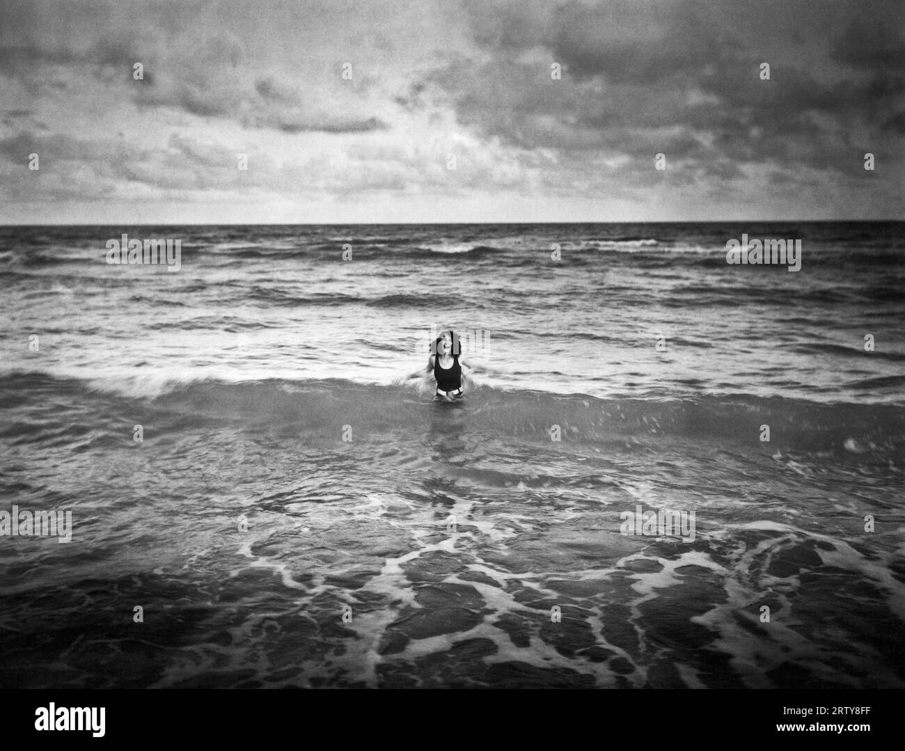 Miami, Florida: c. 1924 Miss Carol Griffith enjoys having the ocean to herself. Stock Photo