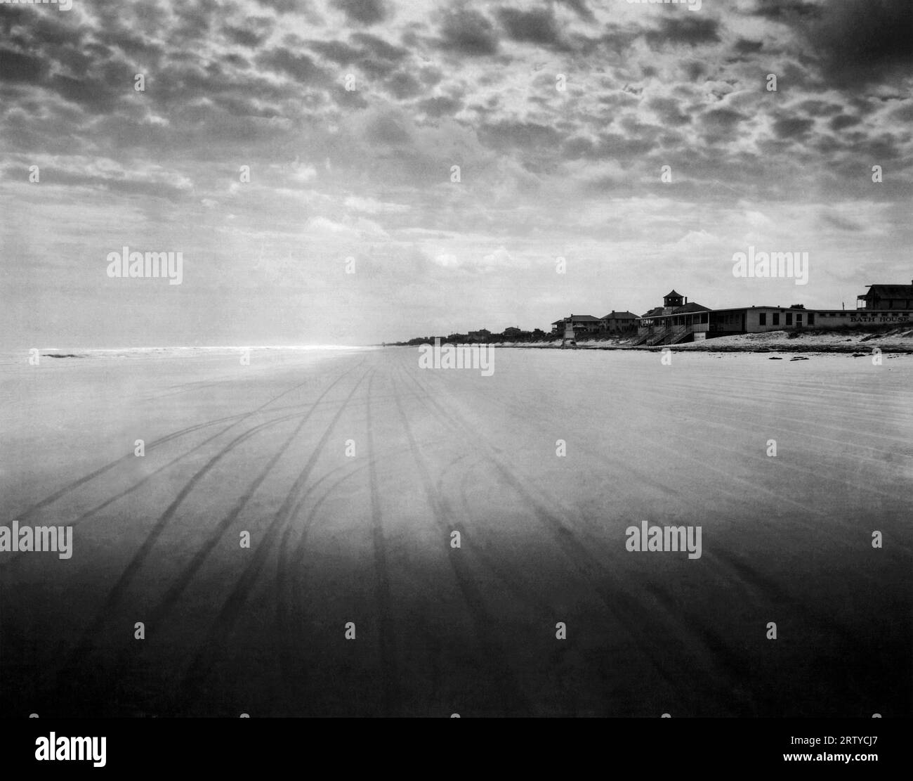 Daytona Beach, Florida: c. 1924 View of tire tracks on the sand at Daytona Beach during low tide. Forty cars may race abreast down this beach during such times. Stock Photo