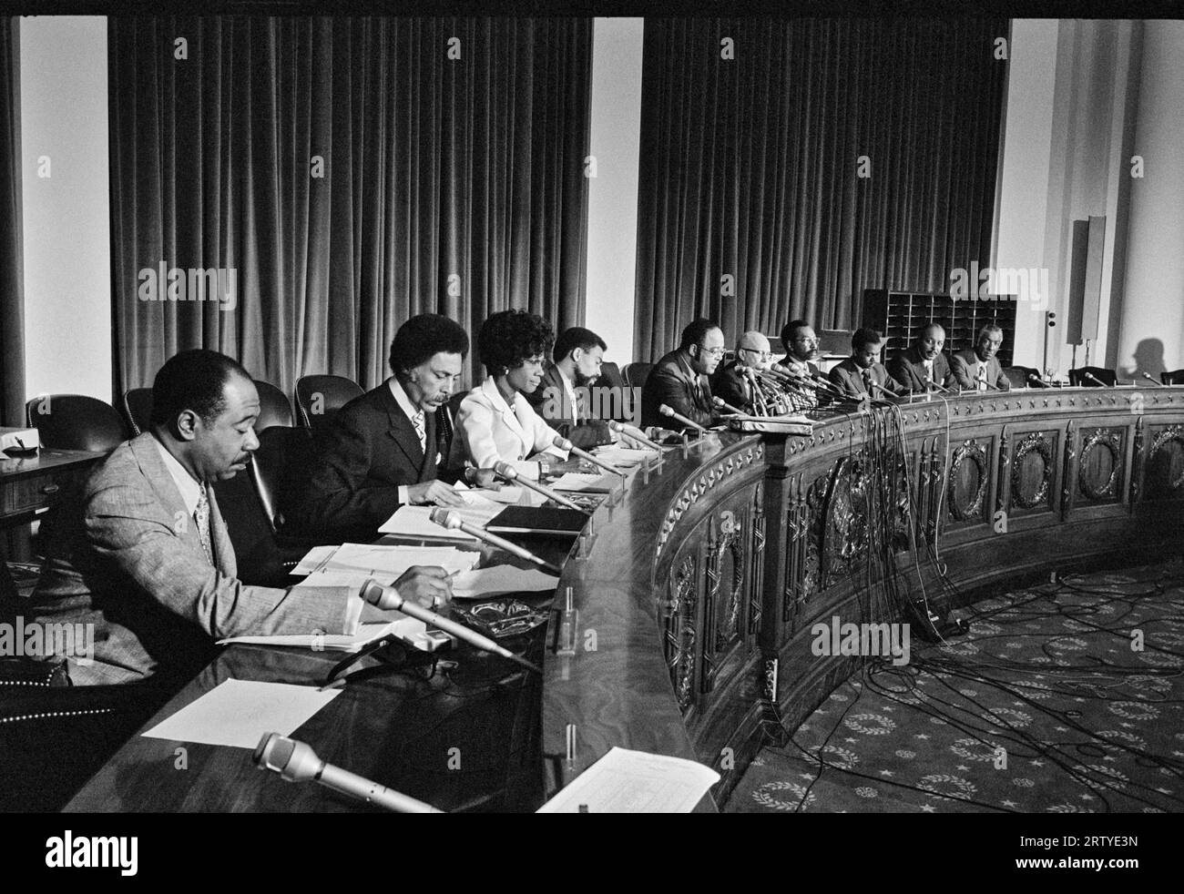 Washington, D.C.  May 24, 1971 Congressional Black Caucus members at a hearing. L-R: George W. Collins (D-Ill.), Ronald V. Dellums (D-Calif.), Shirley Chisholm (D-N.Y.), William L. Clay (D-Mo.), Charles C. Diggs, Jr. (D-Mich.), Augustus F. Hawkins (D-Calif.), Parren J. Mitchell (D-Md.), Walter Fauntroy (D-D.C.), Louis Stokes (D-Ohio), Ralph Metcalfe (D-Ill.) Stock Photo