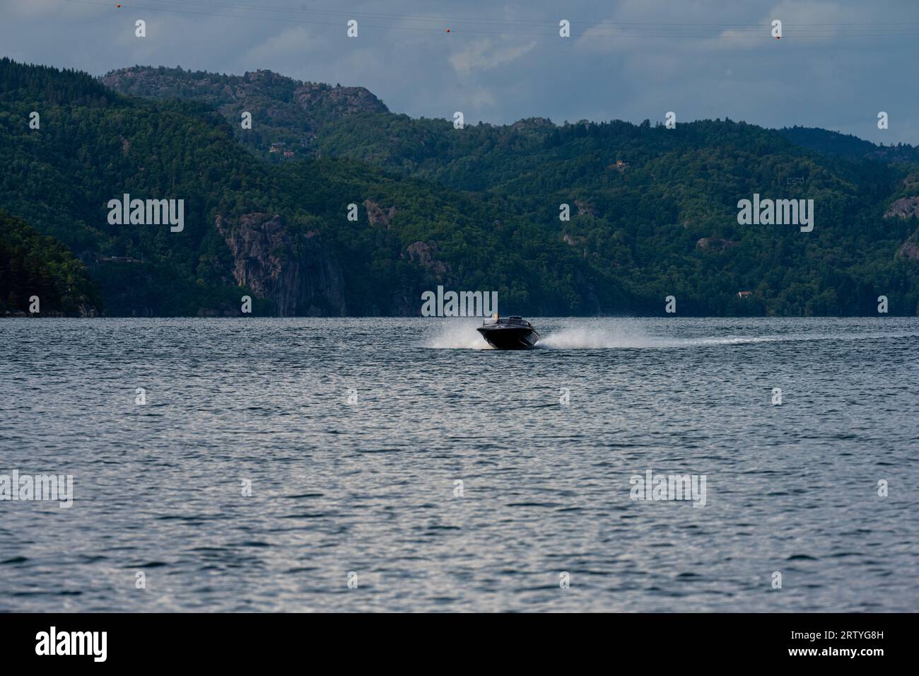 Fast Small Bot Fast small boat in a fjord Stock Photo - Alamy
