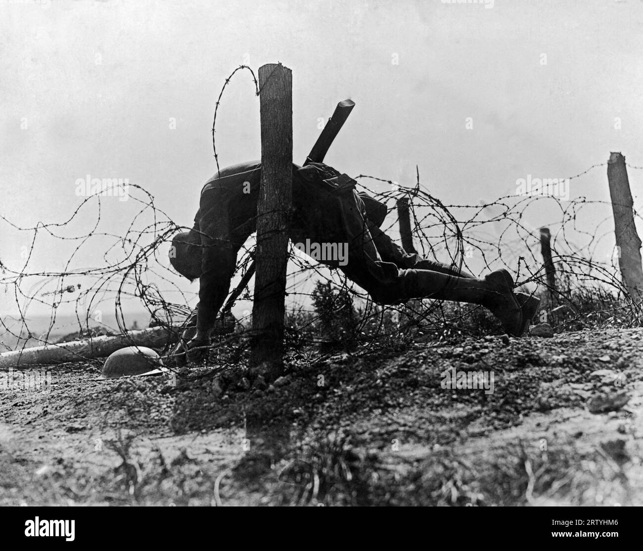 France  1918 Photograph shows an American soldier caught on barbed wire during World War I . Stock Photo