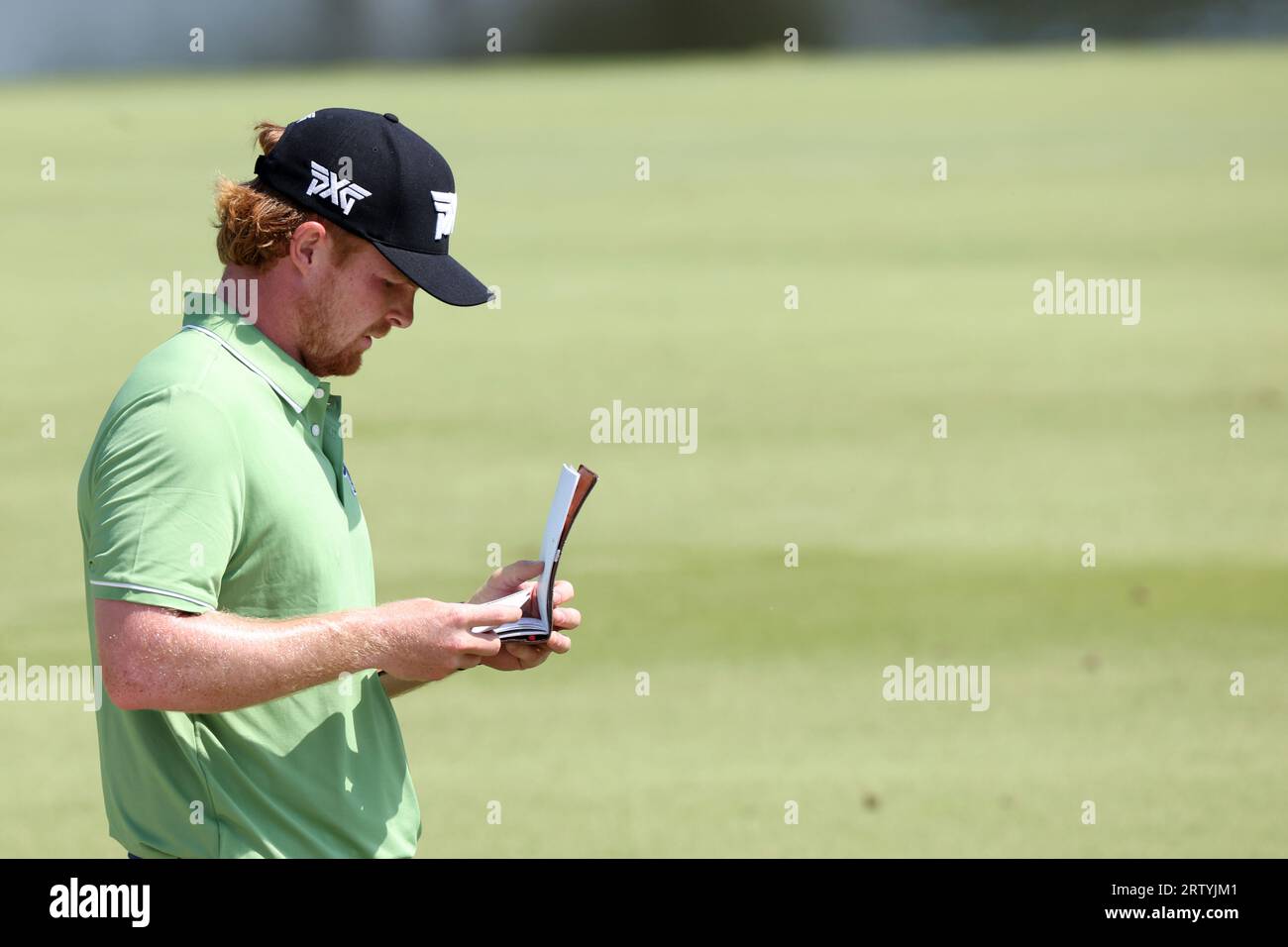 COLLEGE GROVE, TN - SEPTEMBER 15: Mason Anderson checks his yardage ...