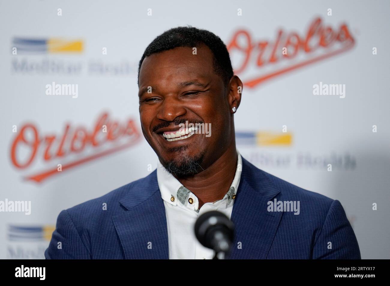 Former Baltimore Orioles player Adam Jones, left, stands on the