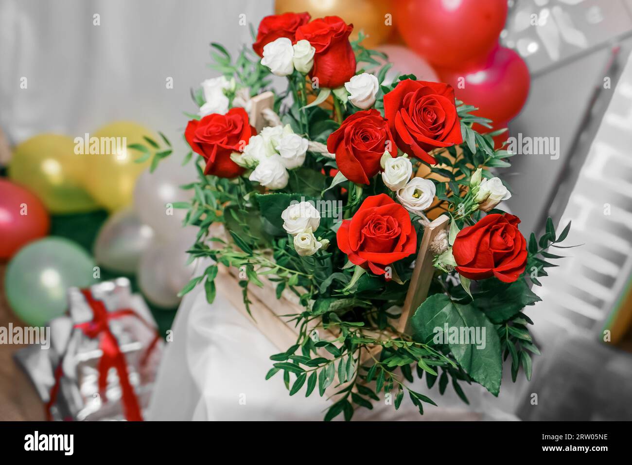 Artificial flowers, bouquet of red and white roses, closeup in a