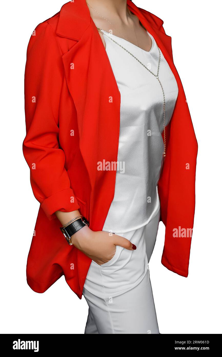 Stylish fashionable girl posing with her hand in her pocket in a white T-shirt and pants and a red jacket on a isolated background. Stock Photo