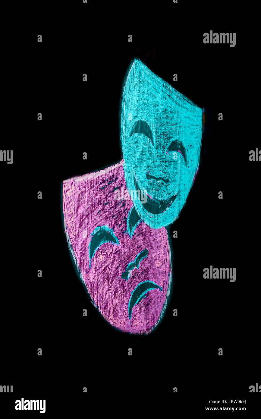 Masks show 2 colored masks sad and cheerful in the black background. Stock Photo