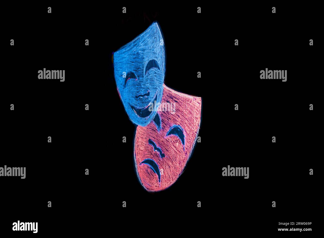Masks show 2 colored masks sad and cheerful in the black background. Stock Photo