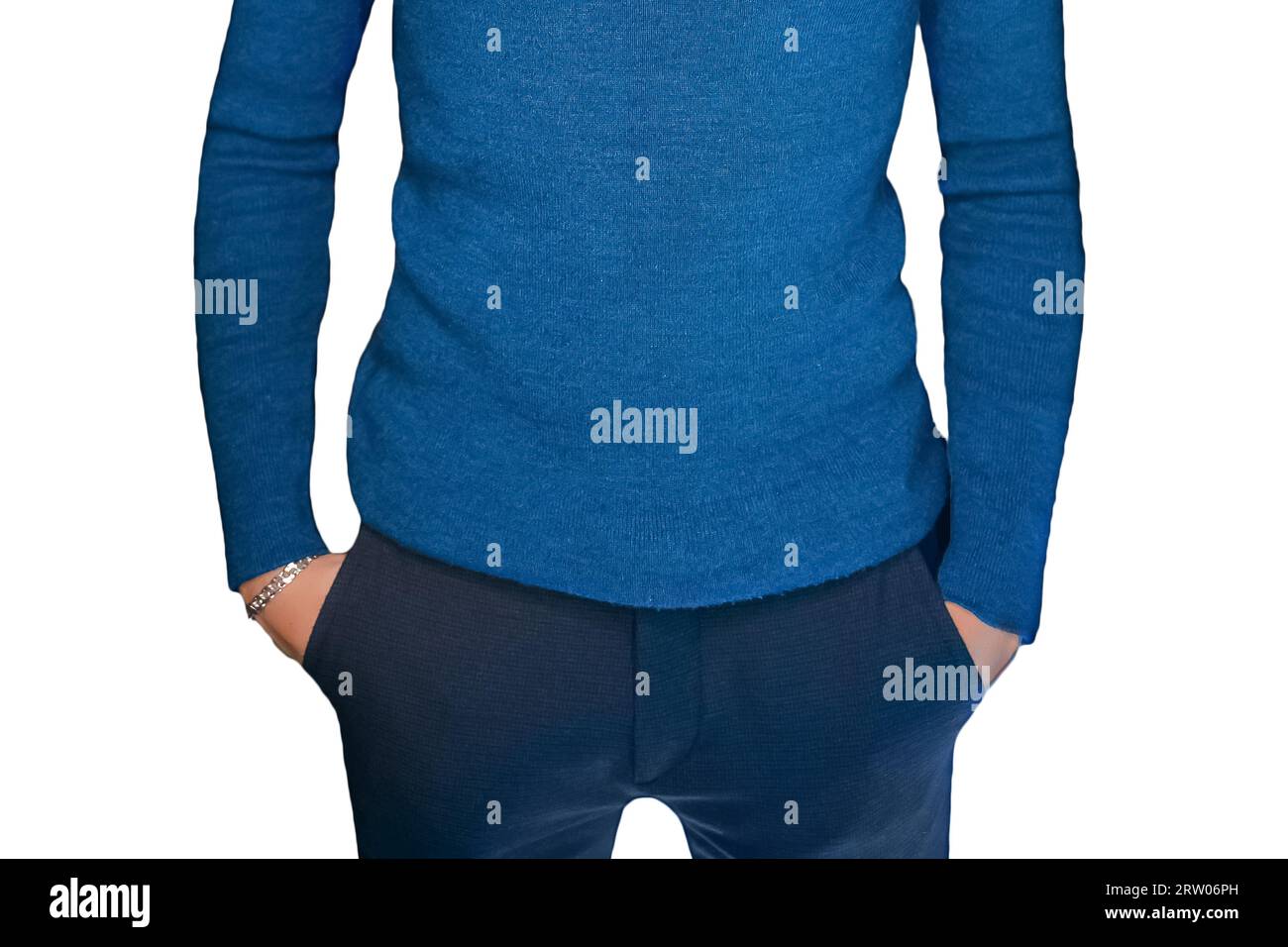 Skinny guy in blue turtleneck men's style of clothing with hands in his